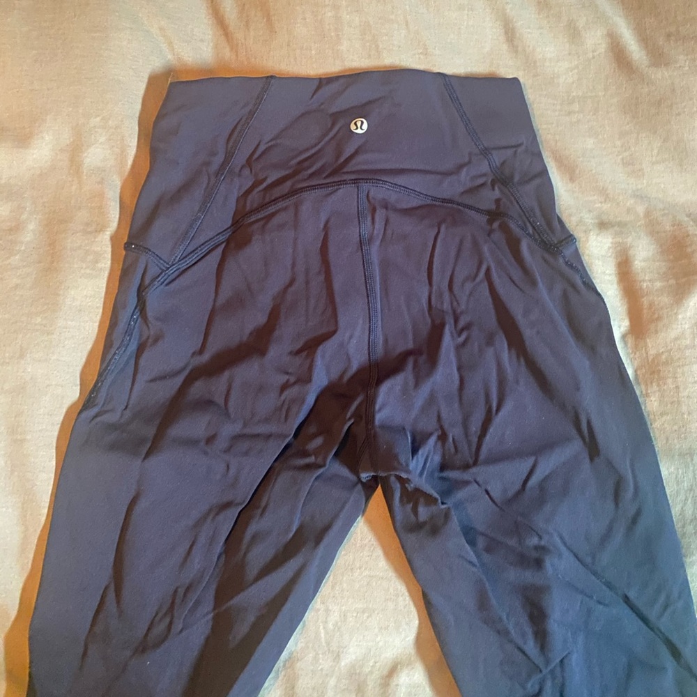 Lululemon size 6 leggings with sheer accents on side